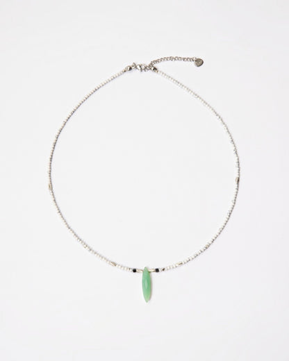 Elsita Jewelry Snowline Green necklace featuring white howlite beads, a green chrysoprase pendant, and silver accents.