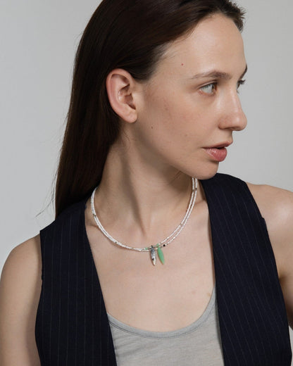 Elsita Jewelry Snowline Green necklace featuring white howlite and green chrysoprase beads on a model