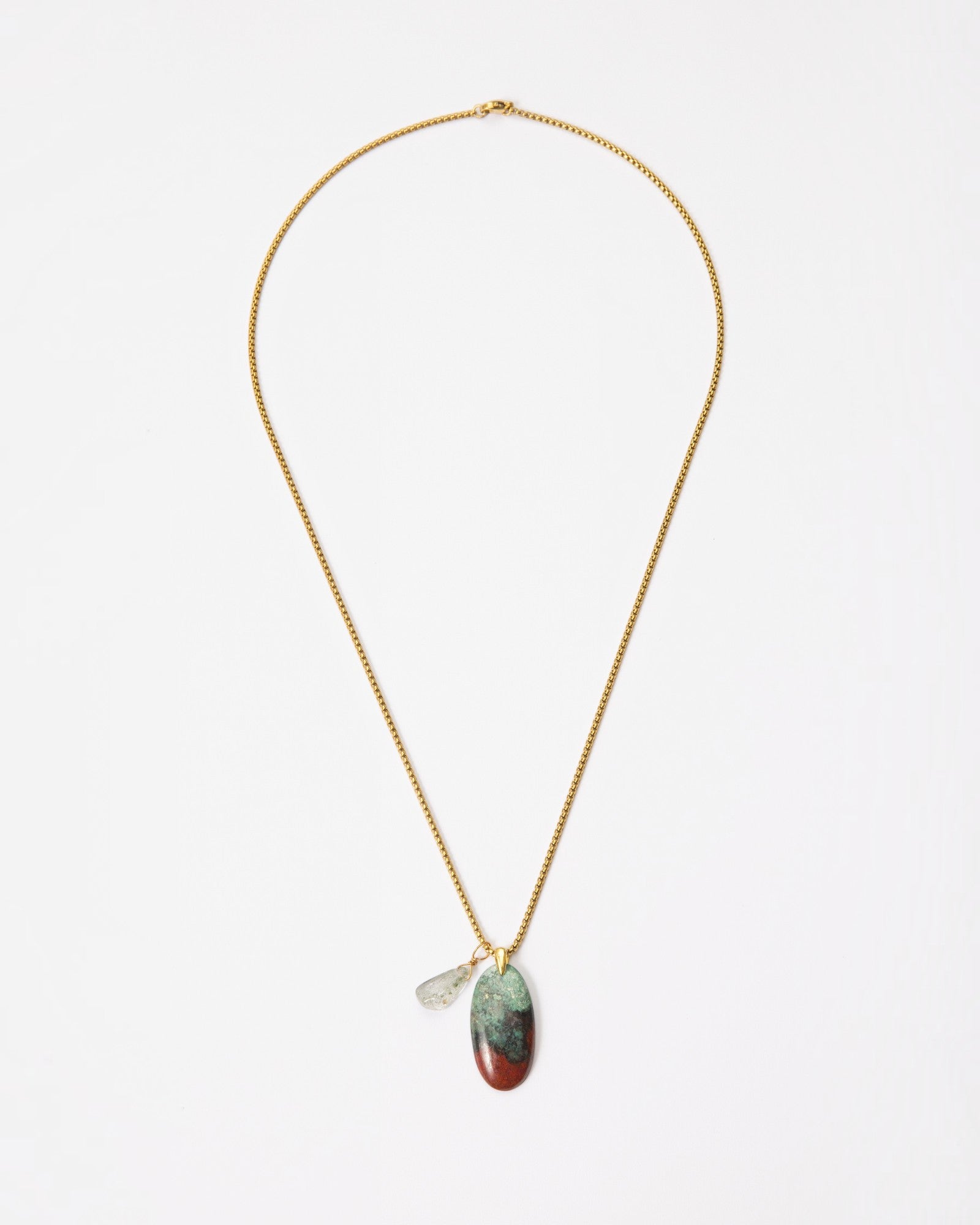 Elsita Jewelry Horizon III necklace featuring a Sonora sunset stone and green quartz pendant on a gold-tone chain.