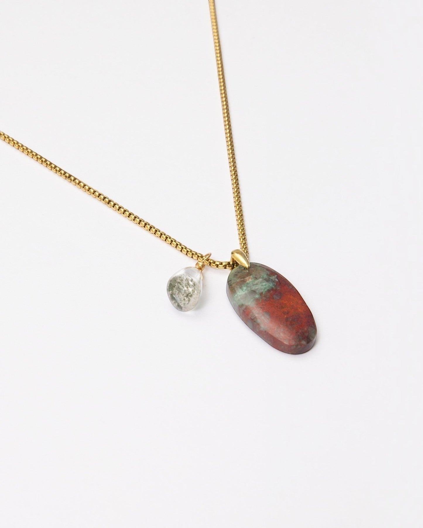 Elsita Jewelry Horizon IV necklace featuring a Sonora sunset stone and green quartz pendant on a gold-tone chain.