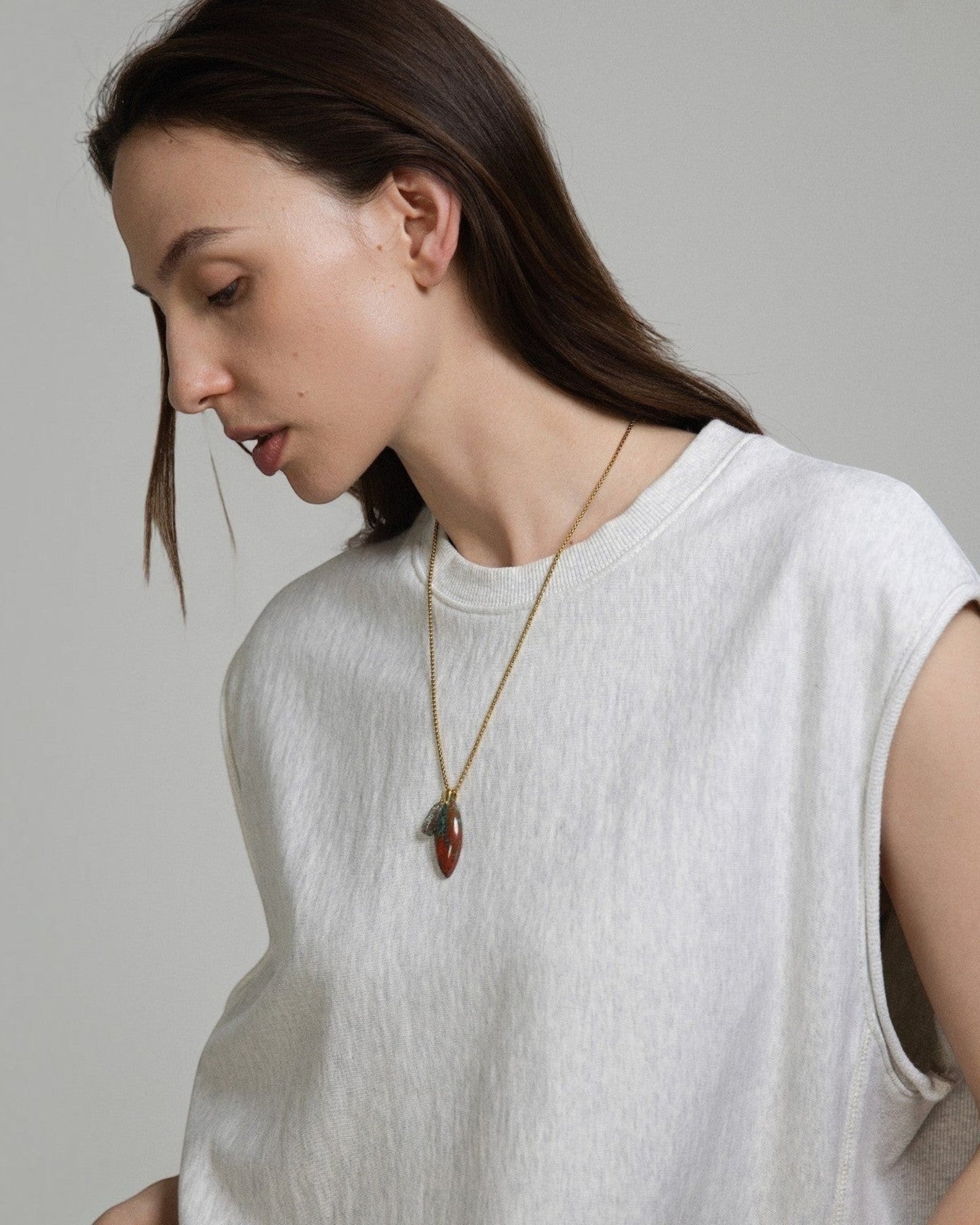 Elsita Jewelry Horizon II necklace featuring a Sonora sunset stone and green quartz pendant on a stainless steel chain.