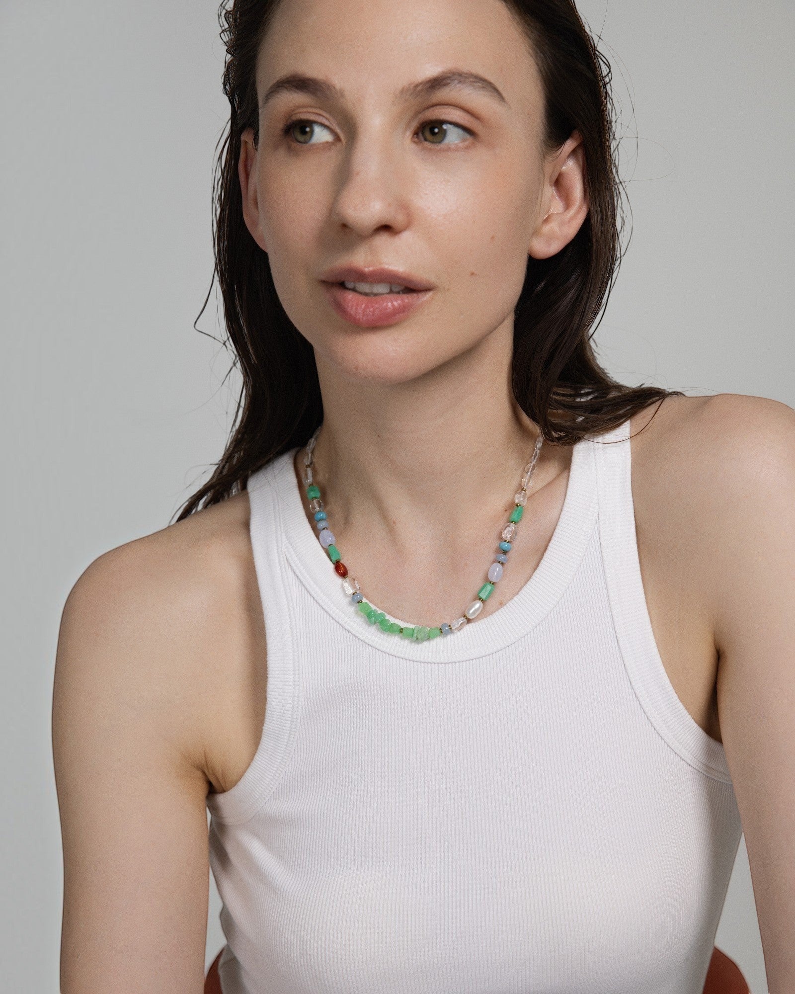 Elsita Jewelry Spring necklace featuring multi-colored chrysoprase, pearl, and mineral beads on a model.
