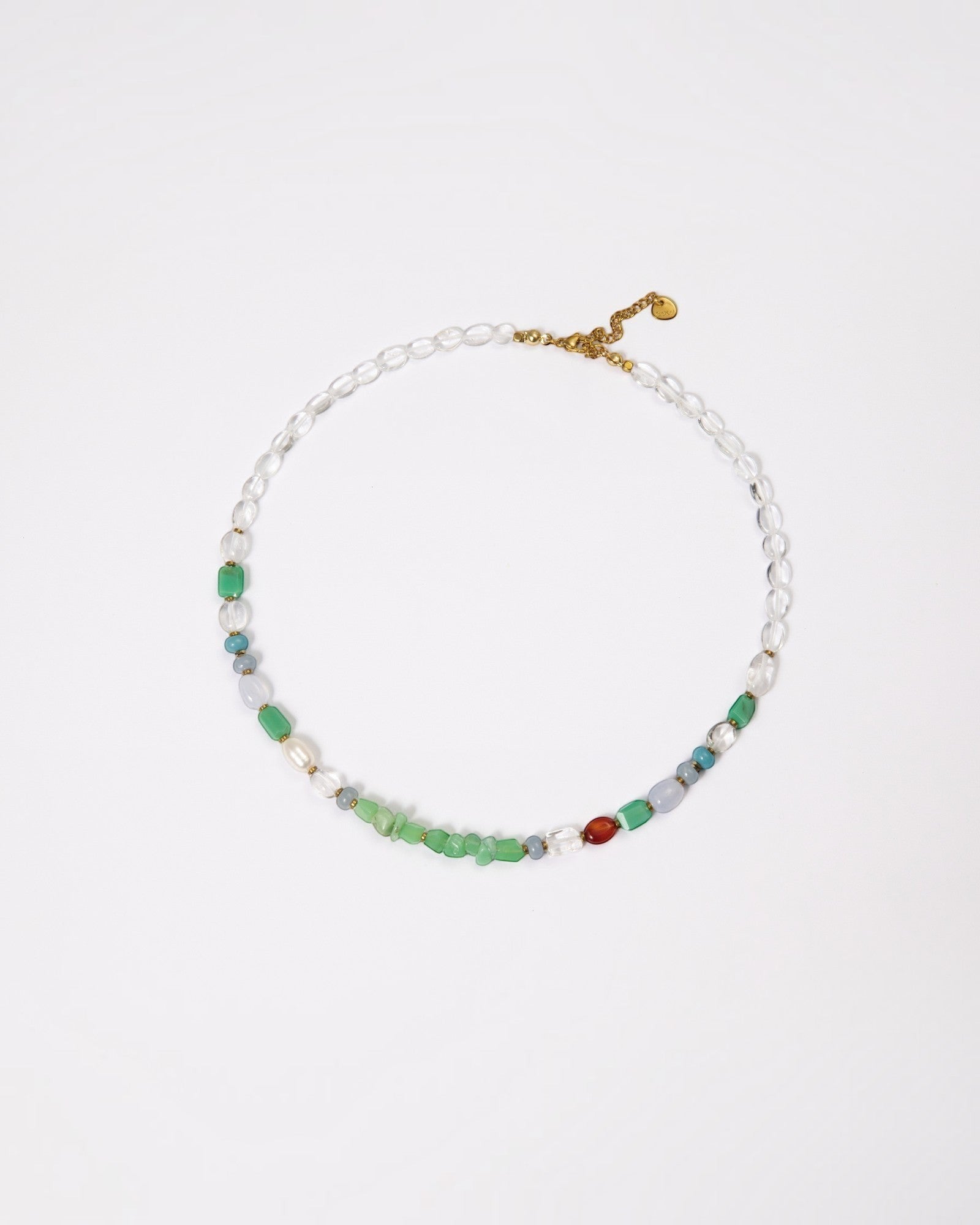 Elsita Jewelry Spring necklace featuring chrysoprase, freshwater pearls, and mixed minerals on a gold-tone chain.