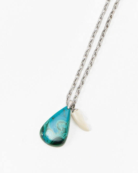 Elsita Jewelry Lagoon IV necklace featuring a teal teardrop pendant and a small white shell charm on a silver chain.