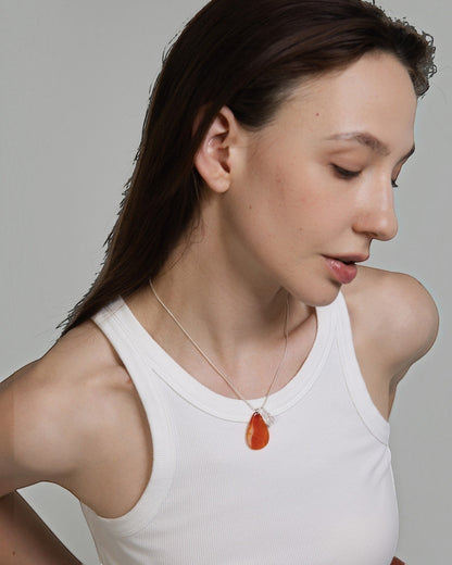 Elsita Jewelry Soda II teardrop red agate and clear quartz pendant necklace on a sterling silver snake chain