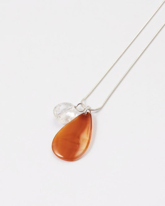 Elsita Jewelry Soda II teardrop red agate and clear quartz pendant necklace on a sterling silver snake chain.