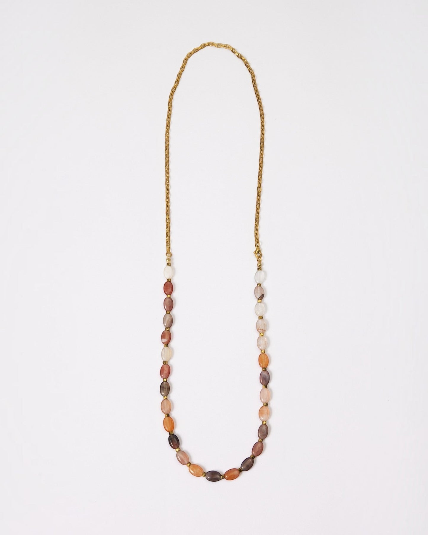Elsita Jewelry Terrain long necklace featuring oval earth-toned agate beads and a gold-tone stainless steel chain.