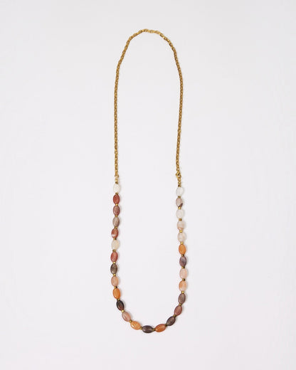 Elsita Jewelry Terrain long necklace featuring oval earth-toned agate beads and a gold-tone stainless steel chain.