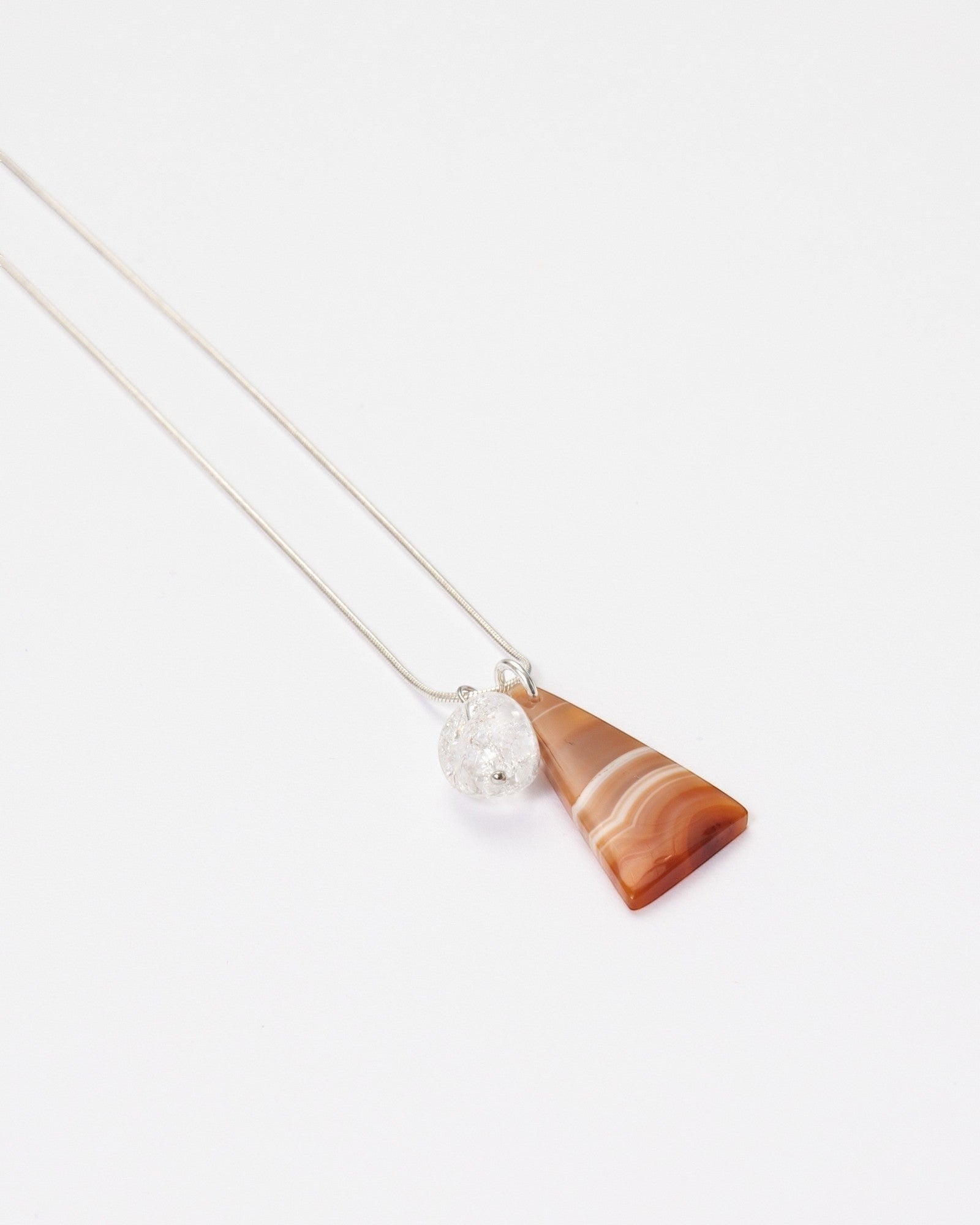 Elsita Jewelry Soda III necklace featuring a triangular red banded agate and clear quartz on a sterling silver chain.