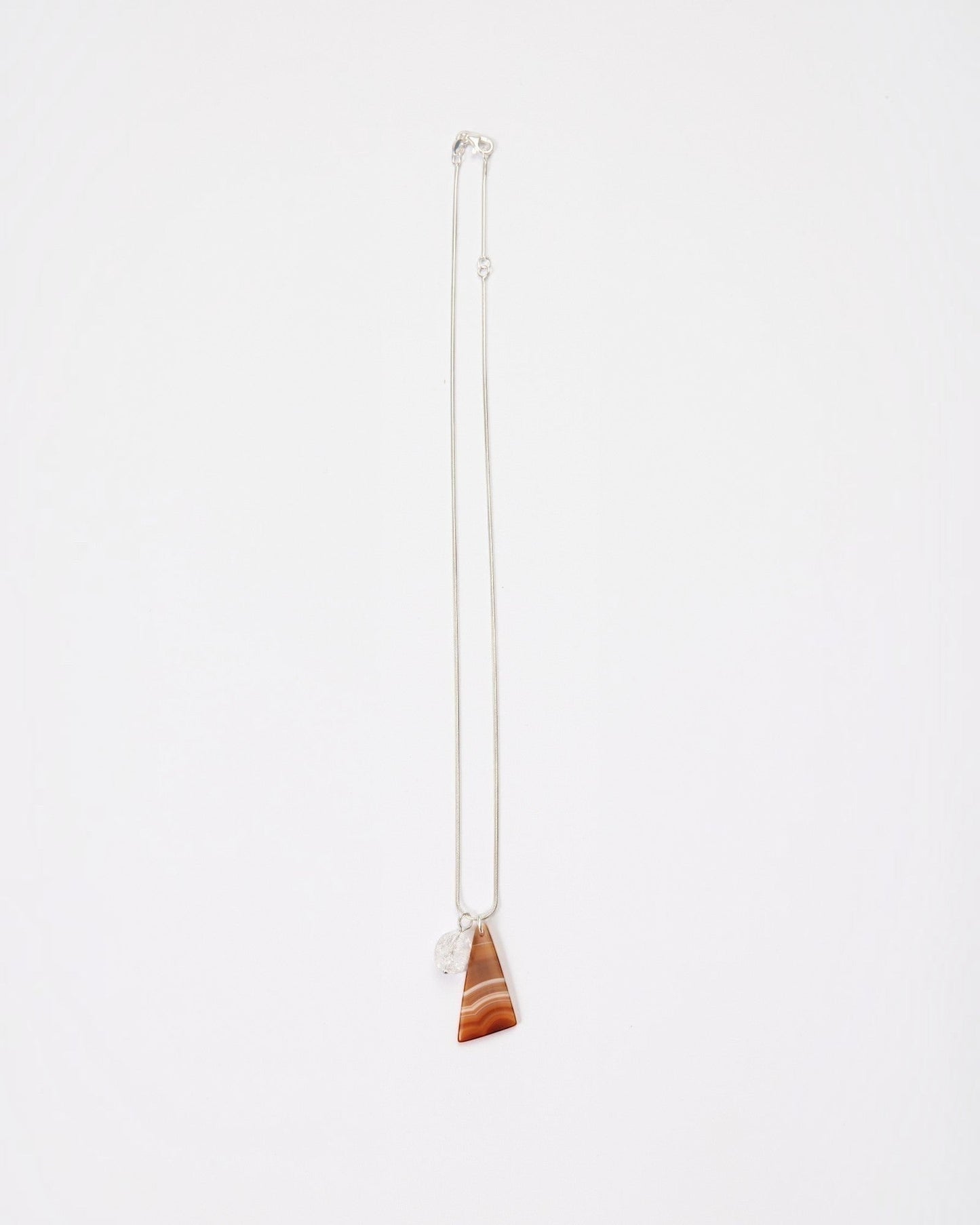 Elsita Jewelry Soda III necklace featuring a triangular red banded agate and clear quartz on a sterling silver chain.