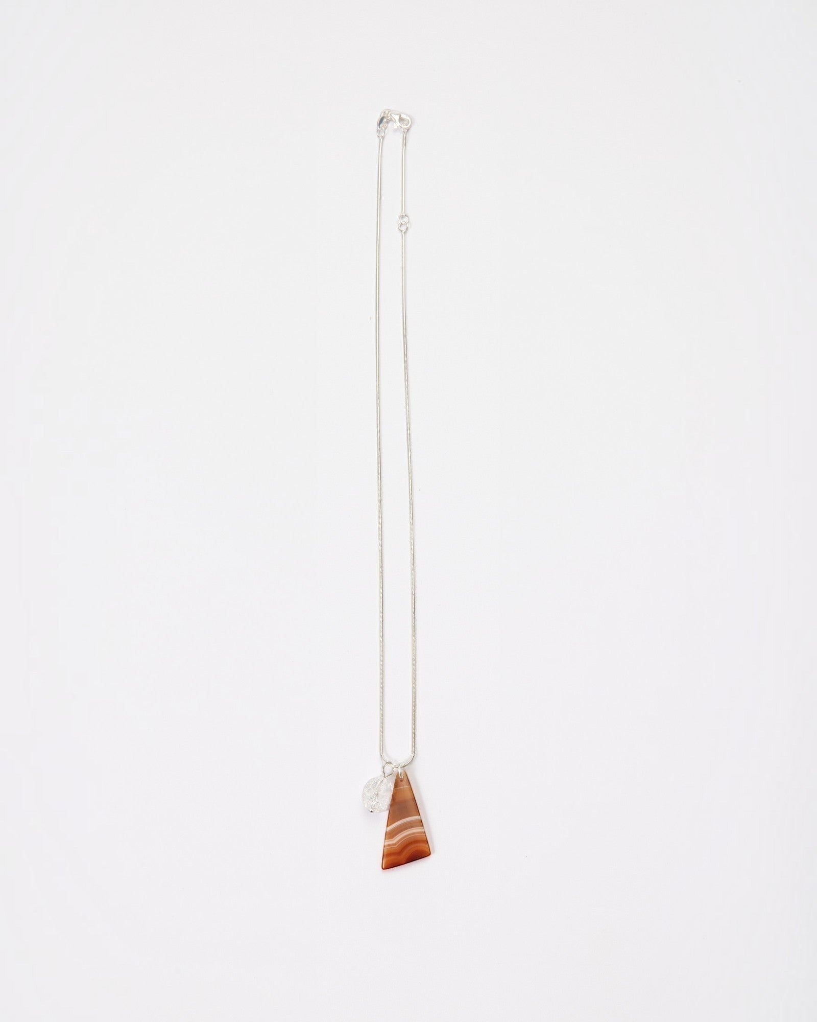 Elsita Jewelry Soda III necklace featuring a triangular red banded agate and clear quartz on a sterling silver chain.