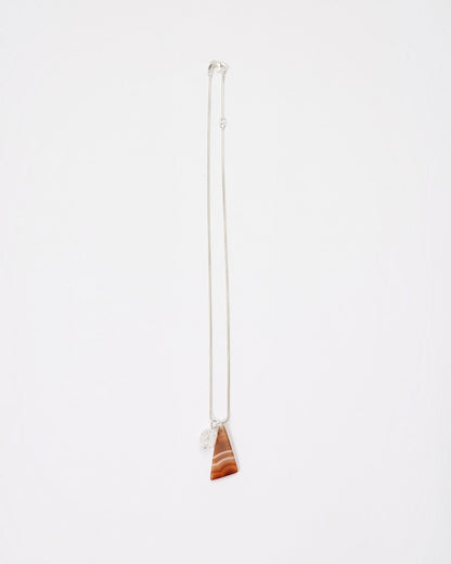 Elsita Jewelry Soda III necklace featuring a triangular red banded agate and clear quartz on a sterling silver chain.