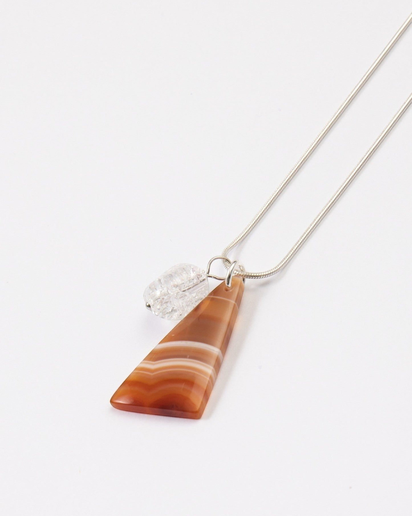 Elsita Jewelry Soda III triangular red agate and clear quartz pendant necklace on a sterling silver snake chain.