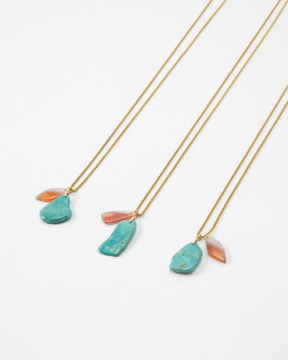 Elsita Jewelry Rusty I necklaces featuring raw turquoise and translucent orange stone pendants on gold chains