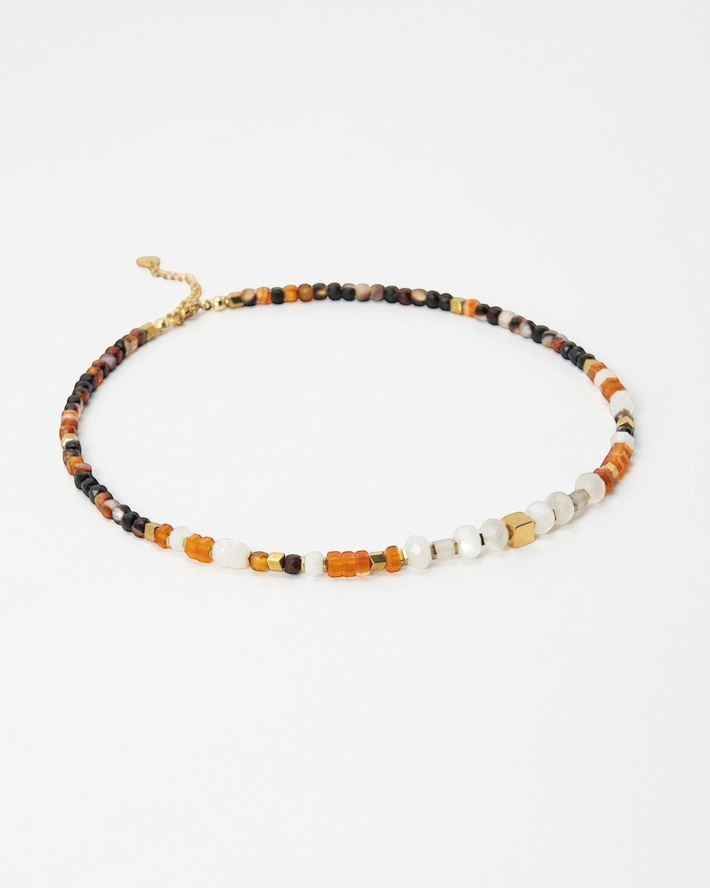 Elsita Jewelry Untamed beaded choker necklace with multi-colored gemstones, pearls, and gold-tone accents.
