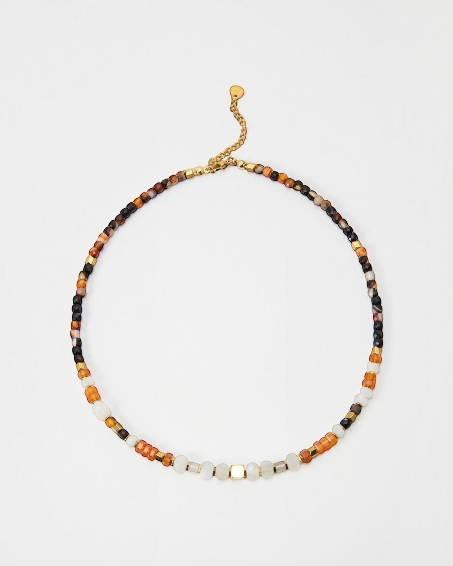 Elsita Jewelry Untamed beaded necklace featuring multi-colored gemstone beads and gold-tone accents on a delicate chain.