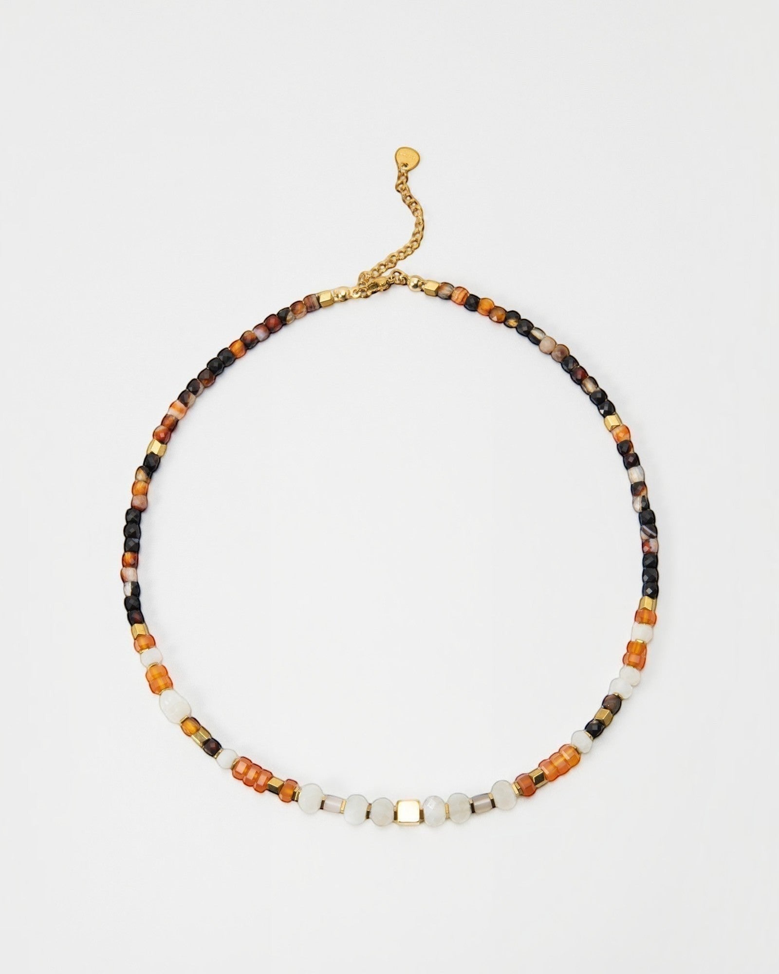 Elsita Jewelry Untamed beaded necklace featuring multi-colored gemstone beads and gold-tone accents on a delicate chain.