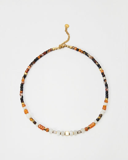 Elsita Jewelry Untamed beaded necklace featuring multi-colored gemstone beads and gold-tone accents on a delicate chain.