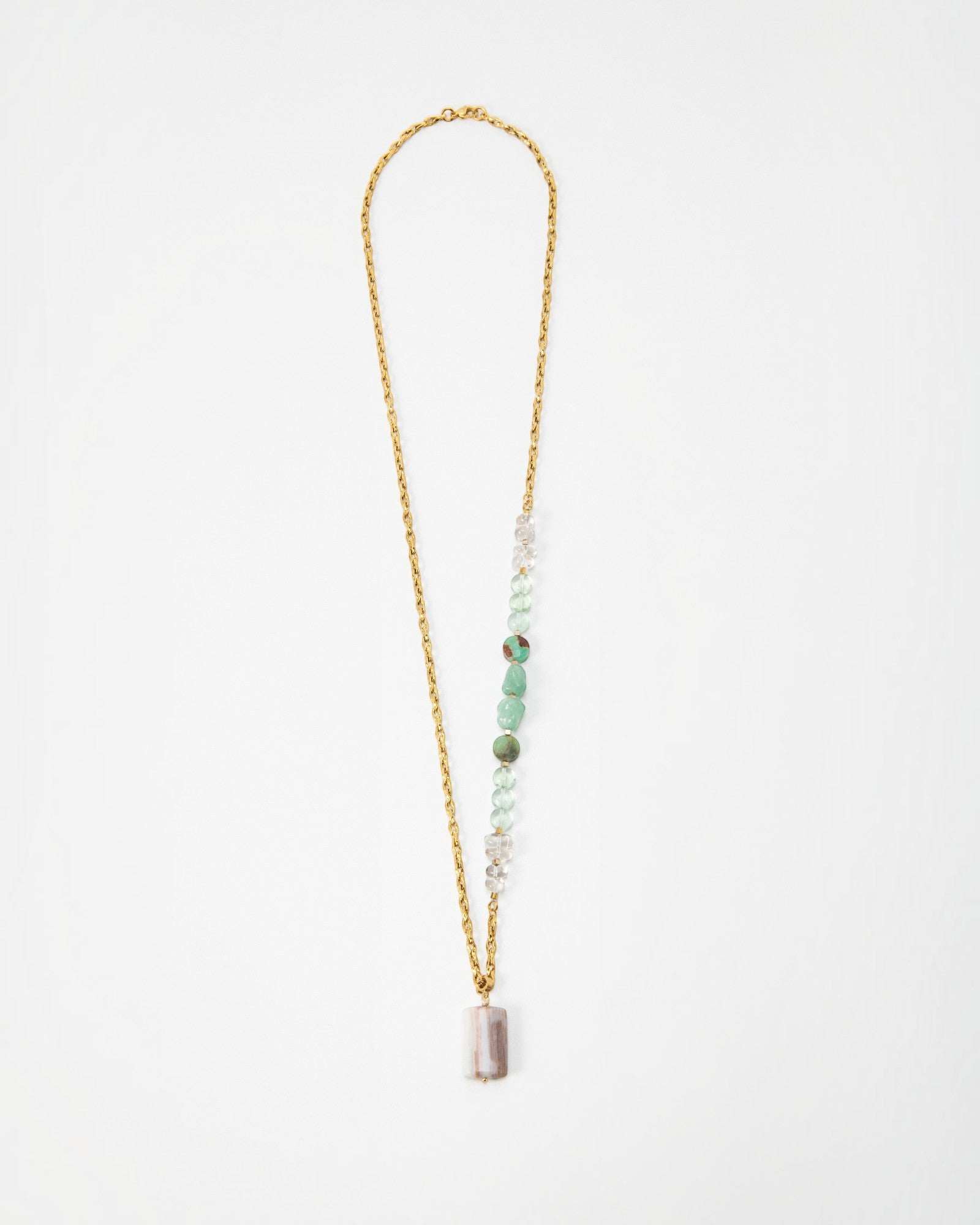 Elsita Jewelry Wandern necklace featuring a gold chain with green and clear gemstone beads and a rectangular pendant