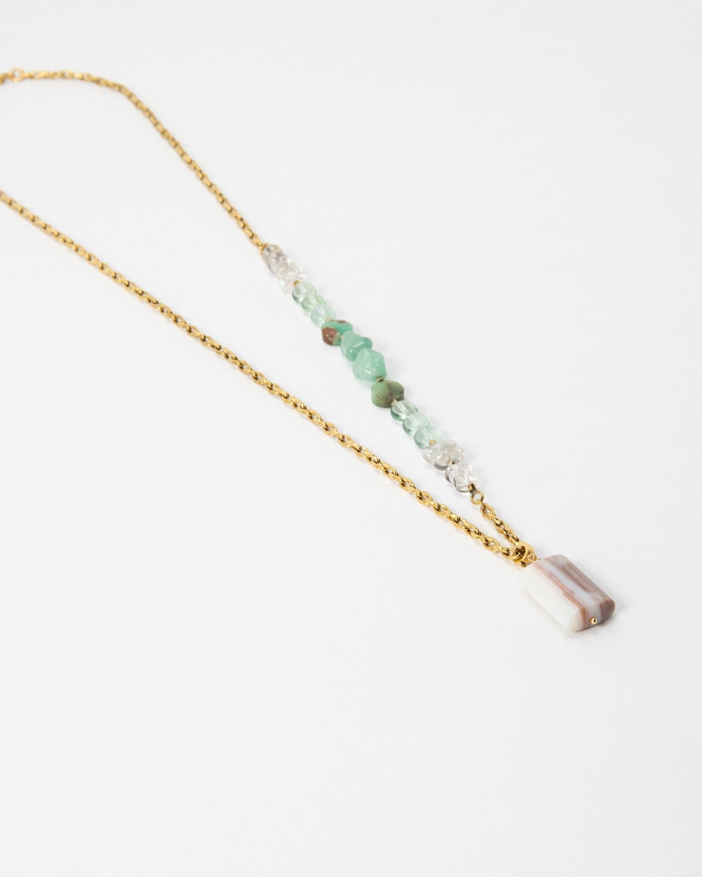 Elsita Jewelry Wandern necklace featuring a gold chain, green gemstone beads, and a rectangular striped stone pendant.