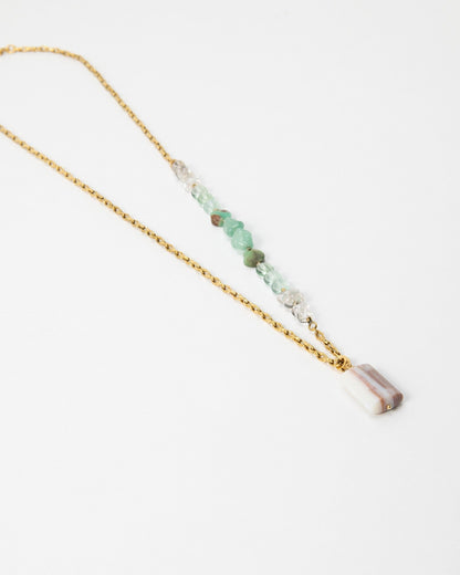 Elsita Jewelry Wandern necklace featuring a gold chain, green gemstone beads, and a rectangular striped stone pendant.
