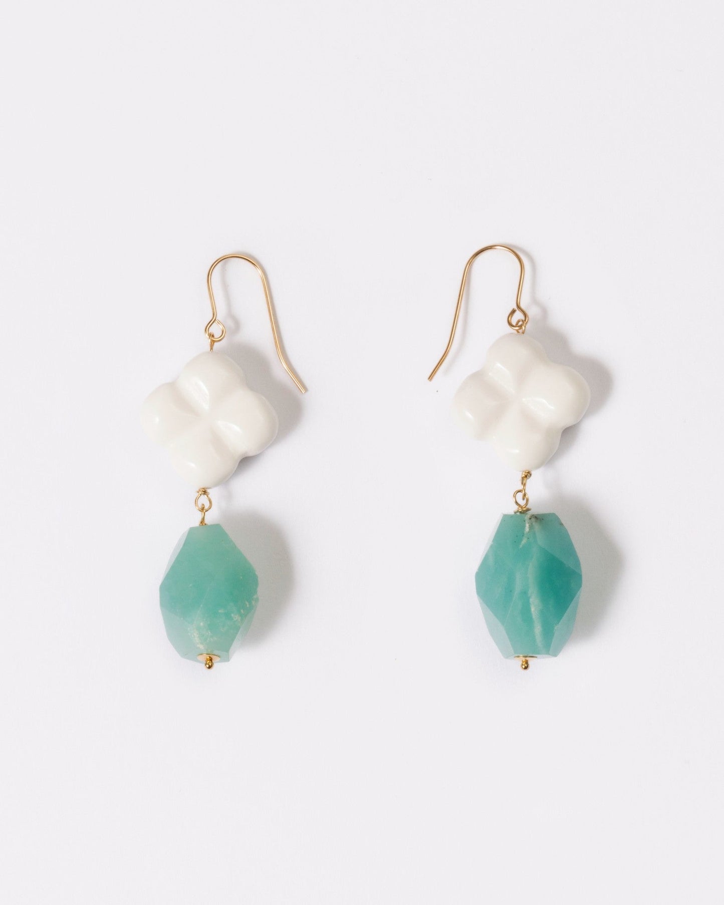 Elsita Jewelry Sky earrings featuring faceted lagoon-blue Amazonite and white clover-shaped Agate on 14K gold hooks.