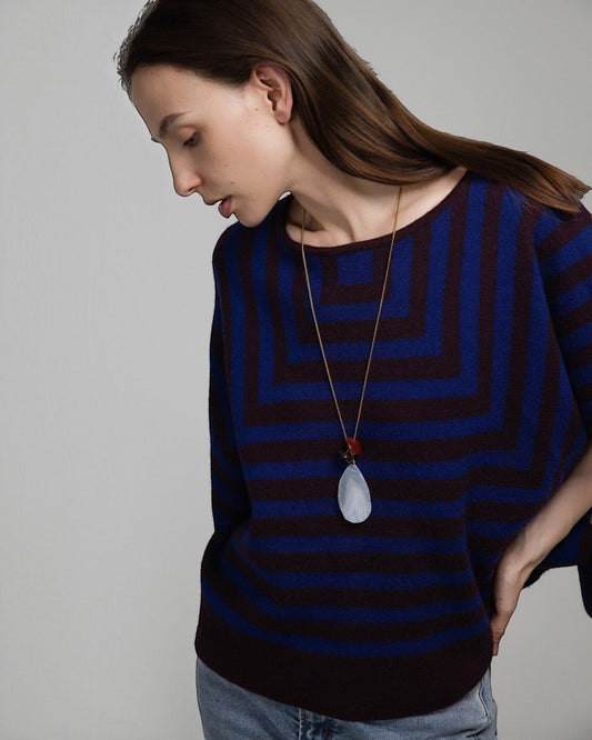 Elsita Jewelry Glacier Day necklace featuring a white agate pendant and red agate accent on a gold-tone chain