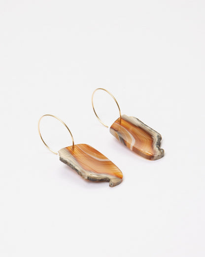 Elsita Jewelry Wild 8 earrings featuring raw, freeform Indonesian agate slices in warm earth tones on 14K gold-filled hoops.